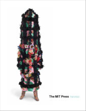 The Fall 2022 cover shows art by Nick Cave called Soundsuit. It is a mixed media including vintage textile and flowers, sequined appliqués, metal and mannequin. It is mostly black structure with floral appliques, standing on two feet.